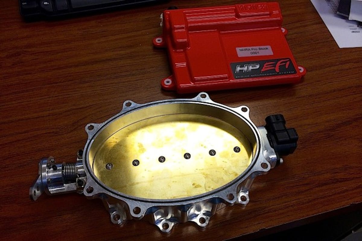 The two main components for Holley that will comprise the new Pro Stock indiction package: an oval throttle body with 25 square inches of opening and an HP EFI electronic control unit.