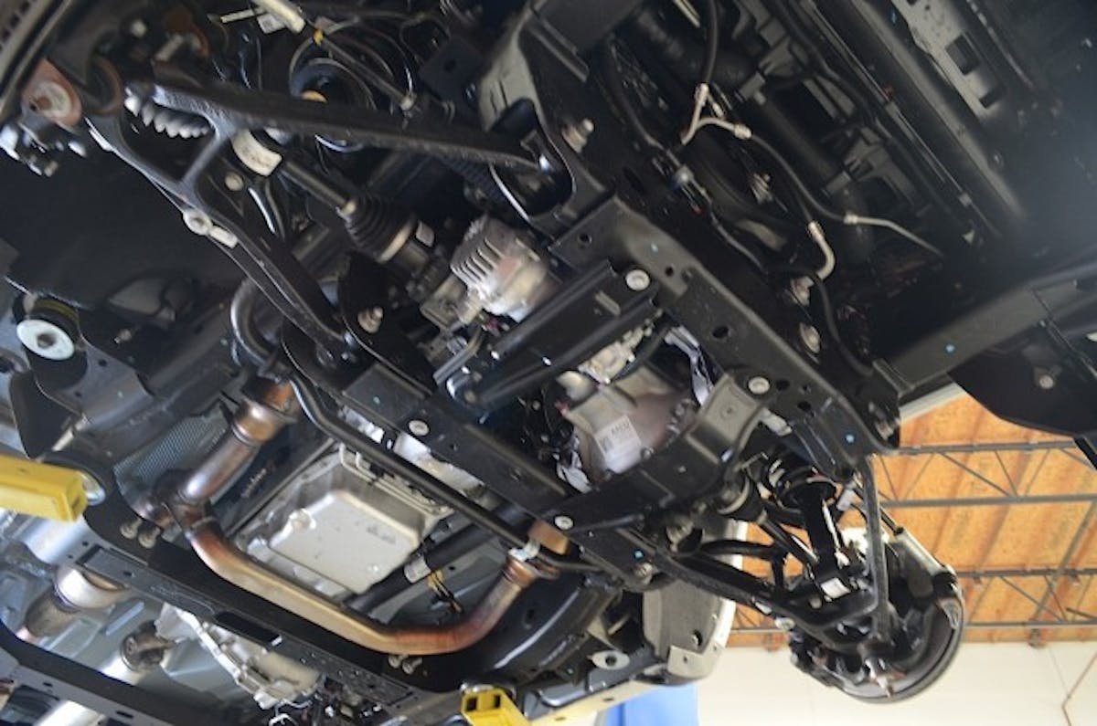 With the factory skid plate removed we could see everything we had to remove.