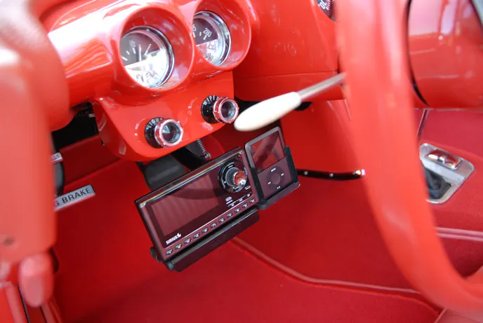 A hidden mechanism swings from under the dash to reveal a Satellite Radio and iPod controls. Other electronics include a keyless entry and phone/Bluetooth operating through the sound system.