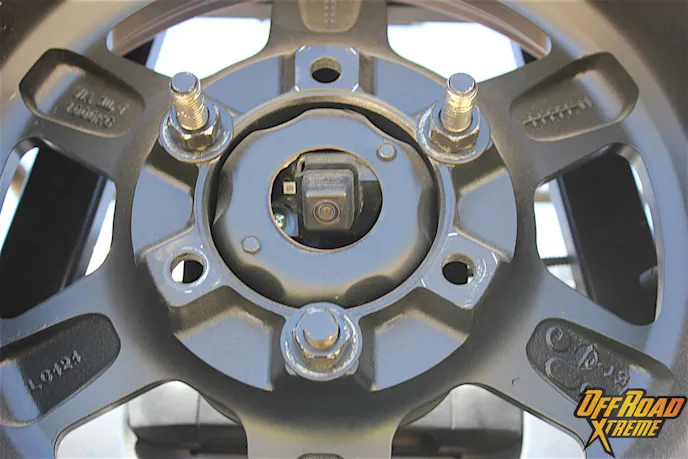 There's a lot of stuff in the way, but Chris can still see thanks to this cleverly mounted camera inside the spare tire mount.