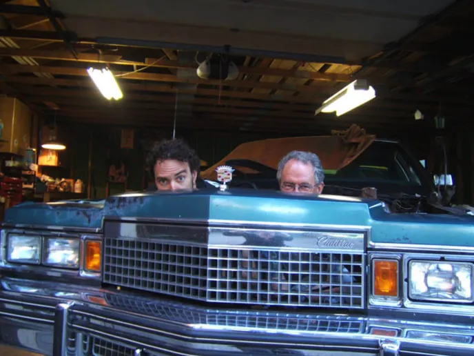 Bovey and his father, working on a Cadillac engine swap...