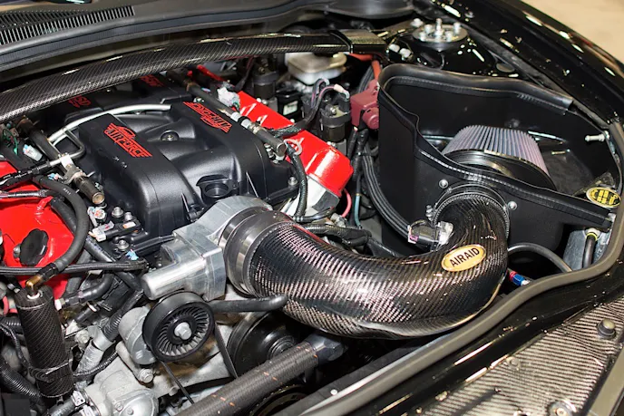 We think carbon-fiber makes a great addition under any car's hood
