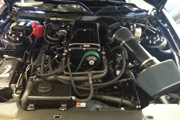 Mustang Performance Racing's Tim Eichorn and crew whipped up a 364-inch engine using a Sonny Bryant crank, Manley I-beam rods, and Diamond pistons. The headers were ported by Kris Starnes, and Bullet Racing cams were set in place before the newly-powdercoated cam covers were reinstalled. The Kenne Bell 4.7L supercharger sits atop the combo with a Mammoth intake. "This is the baddest modular engine I've ever built," MPR's Eichorn says.