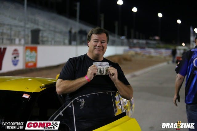 The ever-humble and gracious Coughlin accepting the thousand bucks for his efforts in the Pro Mod Shootout. 