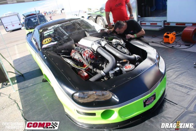 Mike Keenan wasn't in a chatting mood when we dropped by, as he had just diagnosed a blown head gasket on the driver's side of the car.