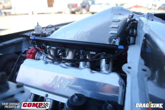 The brand-new 398ci Naiser Racing Components-built engine in Turbo Todd Moyer's 275 Radial machine wears a set of Ultra Pro billet heads from Don Losito, an NRC billet intake manifold, and is pumped up by an 85mm Precision Gen2 turbocharger. The engine is based around a Dart block and these are the first hits on the new engine; crew chief Chase Driskell is sneaking up on the combination.