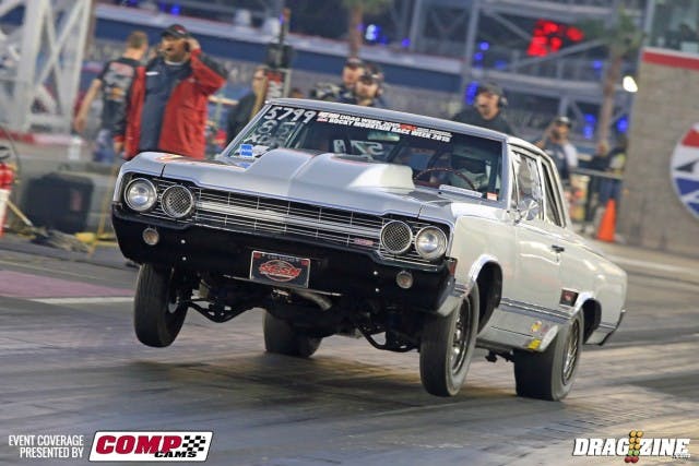 Although he brouight it here in a trailer, Darce Laws isn't afraid to cruise this beautiful beast, as you might deduce from the windshield banners. Laws qualified 25th in the monster Outlaw 8.5 class with a stout 5.23 at 138 mph. Although he's already out of competition after the first round, that's a pretty stout showing for a real street car that sees hard miles. 