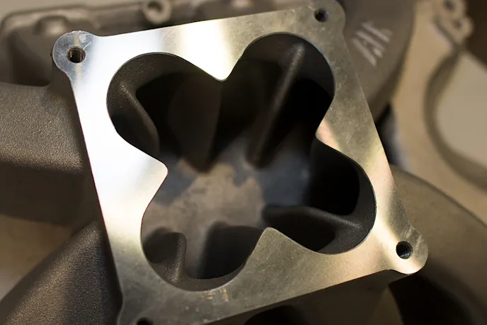 The intake manifold arrives in as-cast condition, but there's plenty of meat left inside for porting if the customer desires.