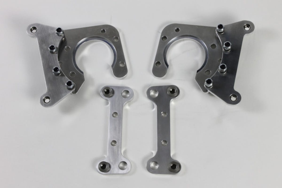 Our rear brake calipers brackets (top) and the front caliper brackets. With the front caliper mount, we're able to use the stock Camaro spindle without any modification.