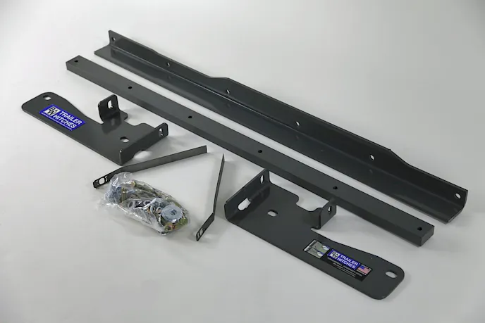 Sideplates like these were designed to bolt to existing holes in a truck's frame, in keeping with an approach that made minimal permanent modifications to a vehicle.