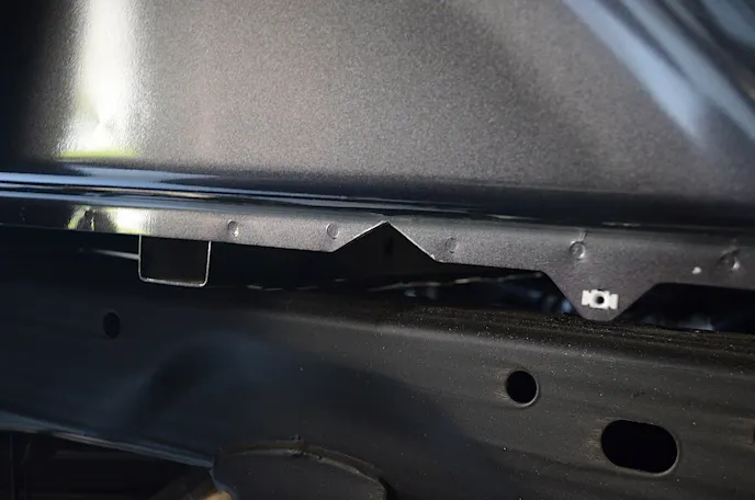 A V-shaped notch was cut into the bed flange to allow the front crossmember to be slid in and across to the other side of the frame.