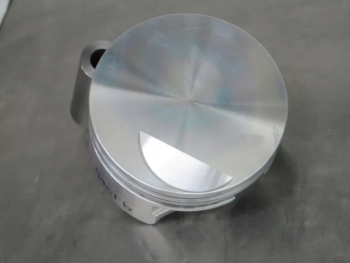 Ross flat top pistons. We attempted to get a truly flat top piston but had to make a concession for the canted intake valve.