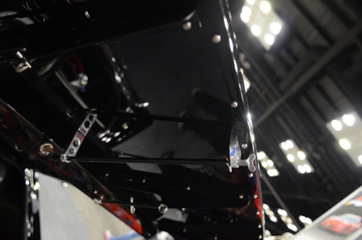 MI Performance added this trick mechanism underneath the rear wing that connects to the original trunk lock, and key allowing, allowing the trunk to be opened without having to reach underneath.