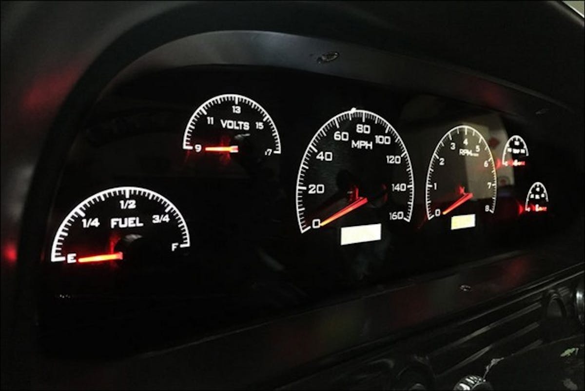 Dakota Digital VHX gauges add a classic look to the truck's interior, and fits right in with the reupholstered seat and custom door panels. 