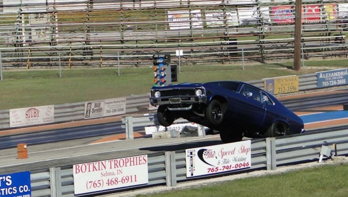 Everyone knows you can't get a tire under a Nova without at least a mini-tub, and that's exactly what Sean's Nova was treated to in order to get a Mickey Thompson ET Street 295/65 radial to fit. Wheelies like this are the result of a well-sorted suspension, a good bit of boost, and the right converter. 