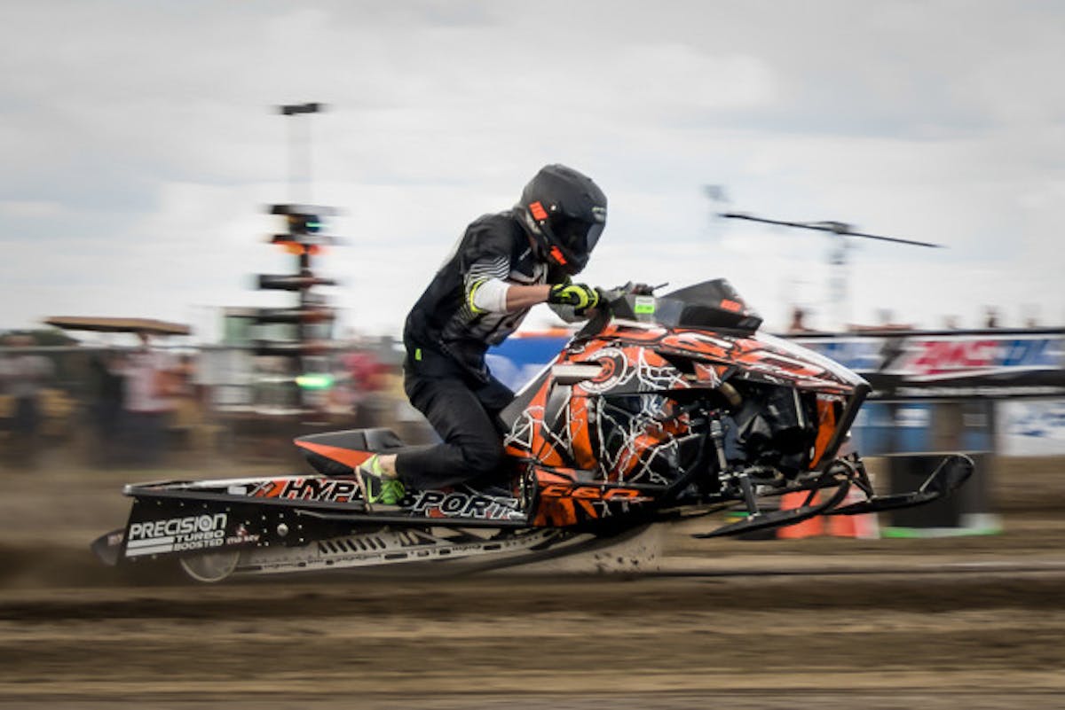 This particular sled, 'Agent Orange 2.0', is owned by Dave Morris and driven by Kelly Shilts.