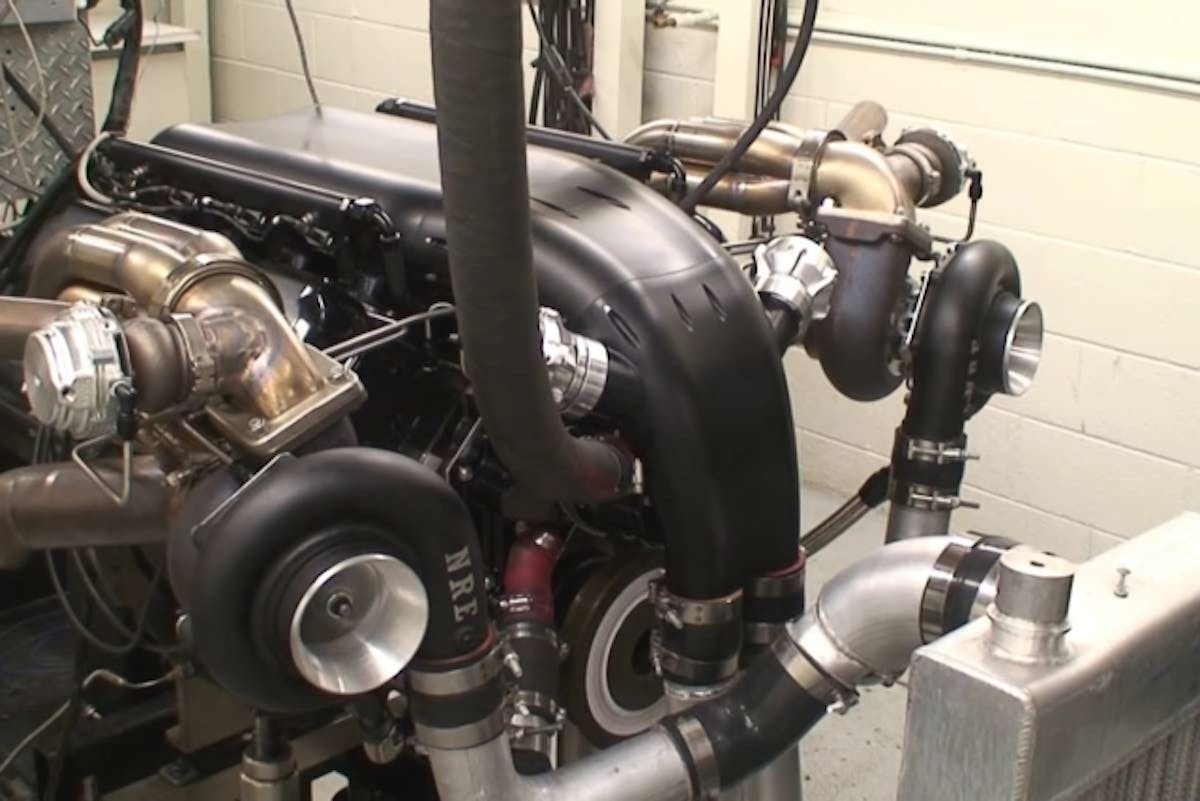 This shot shows the Alien ultra low profile intake in profile, as well as the NRE Mirror Image turbos that were used.  Screencaps from video.