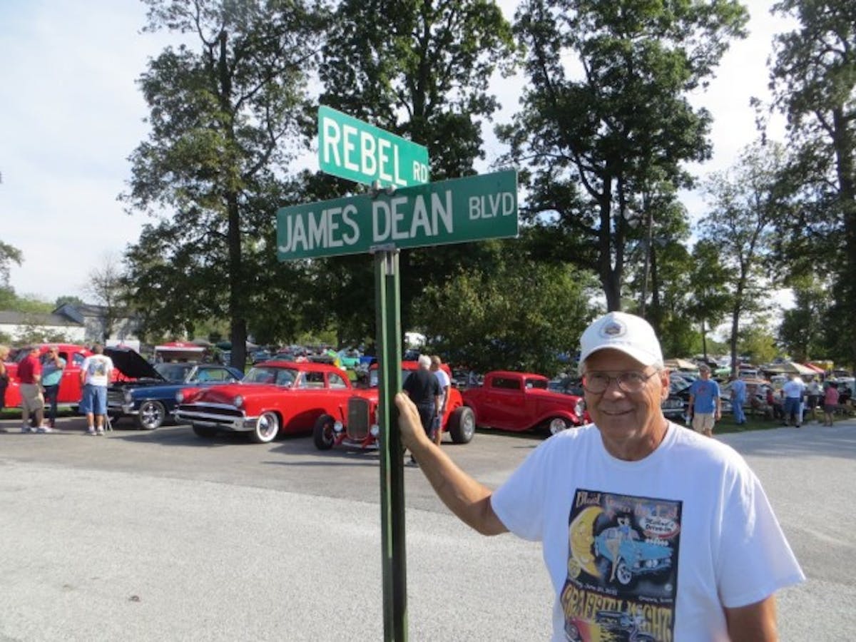 The author standing alongside one of the street signs in the Park