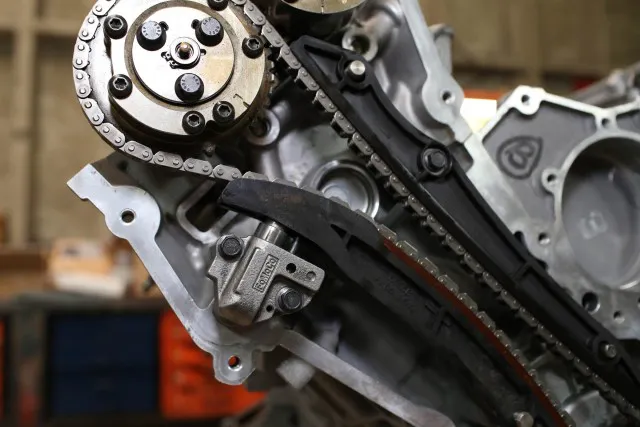 The stock timing chain tensioners have a reputation for failing at the worst possible time. Ford Racing's BOSS 302 timing chain tensioners are designed to support higher rpm engine builds, making them a great option for this motor, considering the high-rpm components we're throwing at it.