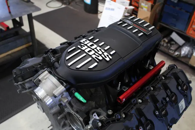 Considering the BOSS 302 intake manifold came as standard equipment on the BOSS 302 Mustang, performance gains versus the stock intake are essentially guaranteed. If you’re considering swapping out the stock intake on your Mustang GT for this one, keep in mind that the GT’s strut tower brace will not clear this intake.