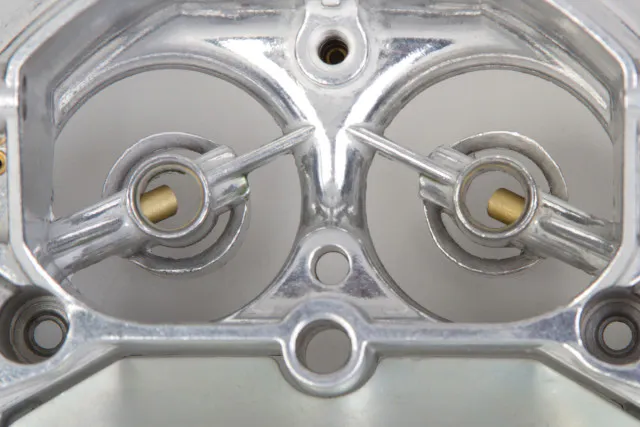 Demon's Triple Stack Boosters help atomize the fuel feeding from the primary venturii. Although it appears to only be two stacks, the third is part of the carburetor body.