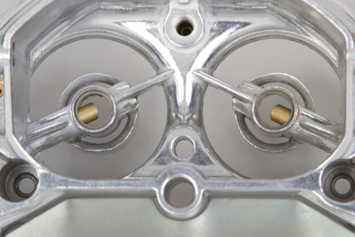 Demon's Triple Stack Boosters help atomize the fuel feeding from the primary venturii. Although it appears to only be two stacks, the third is part of the carburetor body.