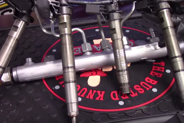A closeup of the fuel injectors in a VW diesel fuel system.