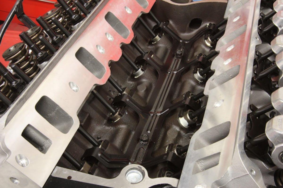 Here’s a set of performance hydraulic roller lifters installed in a late-model small-block Ford. Note the tie-down bar that retains the lifters.
