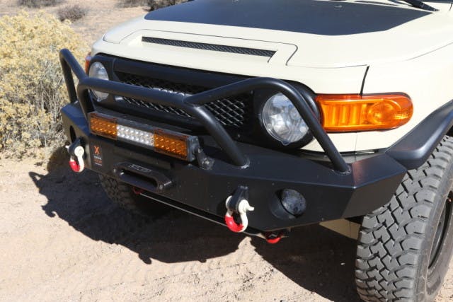 Expedition One front bumper offers excellent protection and solid recovery points. The d-rings have been augmented with a Daystar D-ring isolator kit to keep them from clanking against the bumper.
