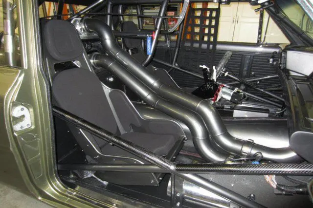 Not to be confused with his own shop, Hot Rod Interiors by Glenn did the Nova's interior, outfitting it with factory door panels, headliner, window cranks, and handles. The rest if pure race with the requisite intercooler and tubing, race seats, roll cage, and fire suppression system.