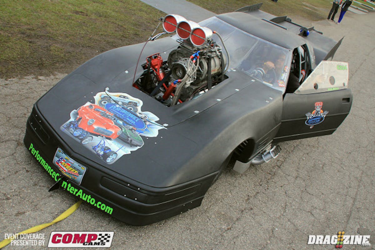 Wayne Smozanek hurt a cylinder here at the Snowbird Outlaw Nats. He ran a 3.93 earlier but put some smoke out on the top end due to blowing a secondary spark plug out of the head. They improvised a repair but had trouble in the second session blowing the burst panel out. The team was just checking things over after the second session and had not diagnosed the cause.