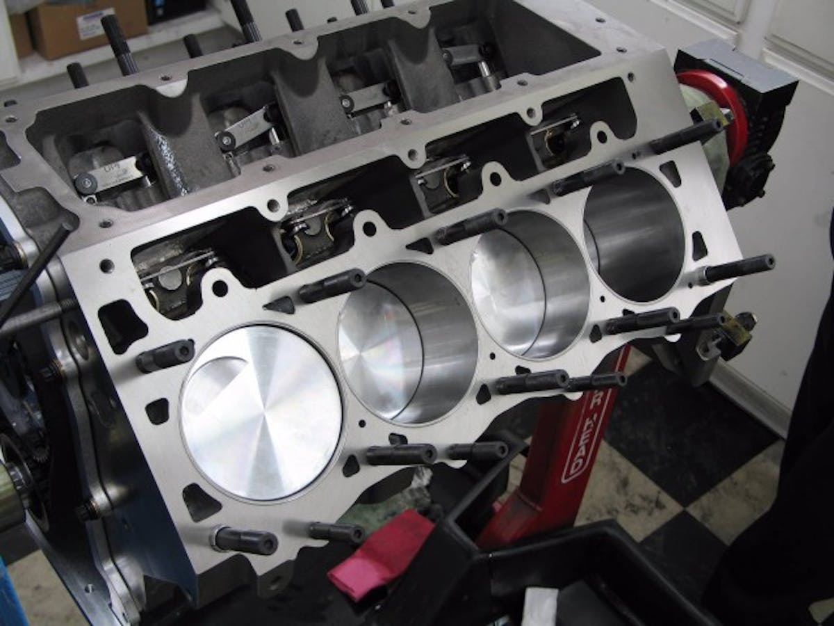 The short block with our Ross flat top pistons taking a peek at the ARP head studs. The studs are relatively short for the large head and we switched to a 1/2 inch stud, both of these factors helped increase strength.