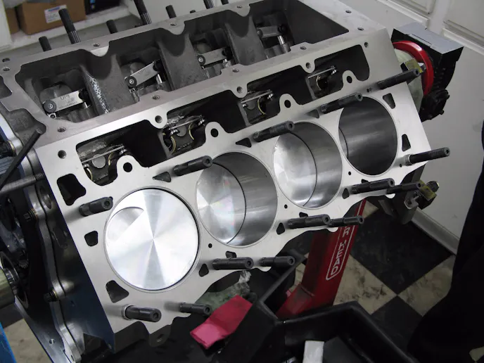 The short block with our Ross flat top pistons taking a peek at the ARP head studs. The studs are relatively short for the large head and we switched to a 1/2 inch stud, both of these factors helped increase strength.