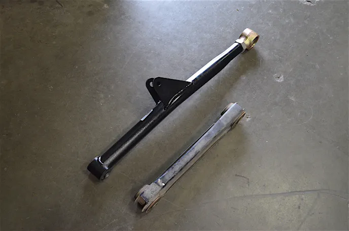 The new Y-arm setup compared to the factory arms.