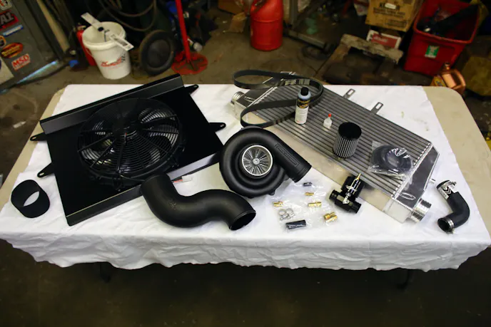 Just part of the Tuner kit we ordered; not shown are the bulk of the inlet tubes, bracket, and a number of other small components. The P-1SC-1 is set up with a 4-inch pulley and maxes out slightly over 9 psi on our car at 7,300 rpm.