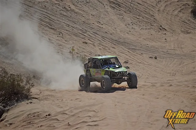 Lucas coming down the sand hill into Chocolate Thunder.