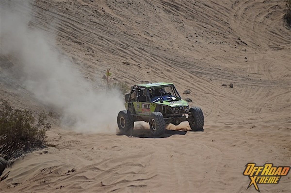 Lucas coming down the sand hill into Chocolate Thunder.