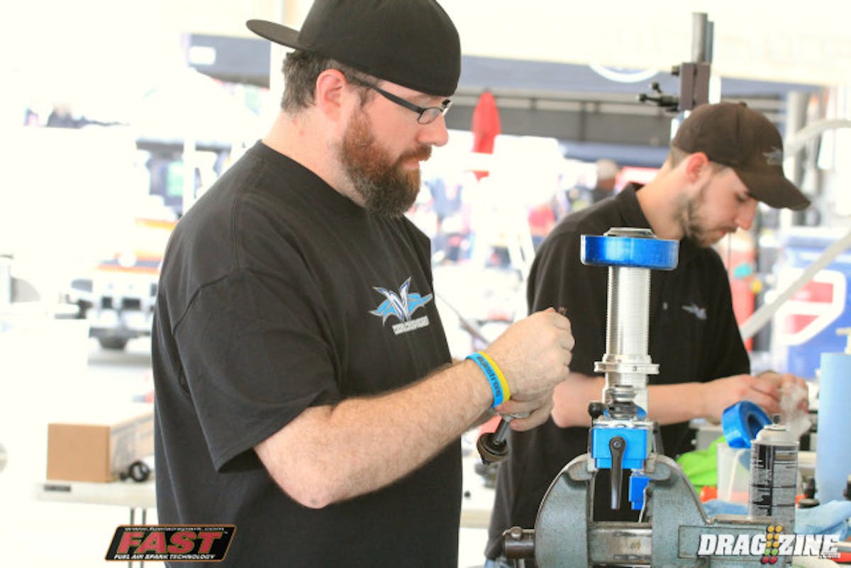 Mark Menscer Motorsports is here providing parts and racer support in conjunction with Afco. Seen here working on a spare struts for Robert Rogers is John Mellon who came on board about two weeks ago. “To good to be true to be with Menscer Motorsports now, it's a dream come true, carreer and life changing opportunity and I am in for the long hall” John Mellon.