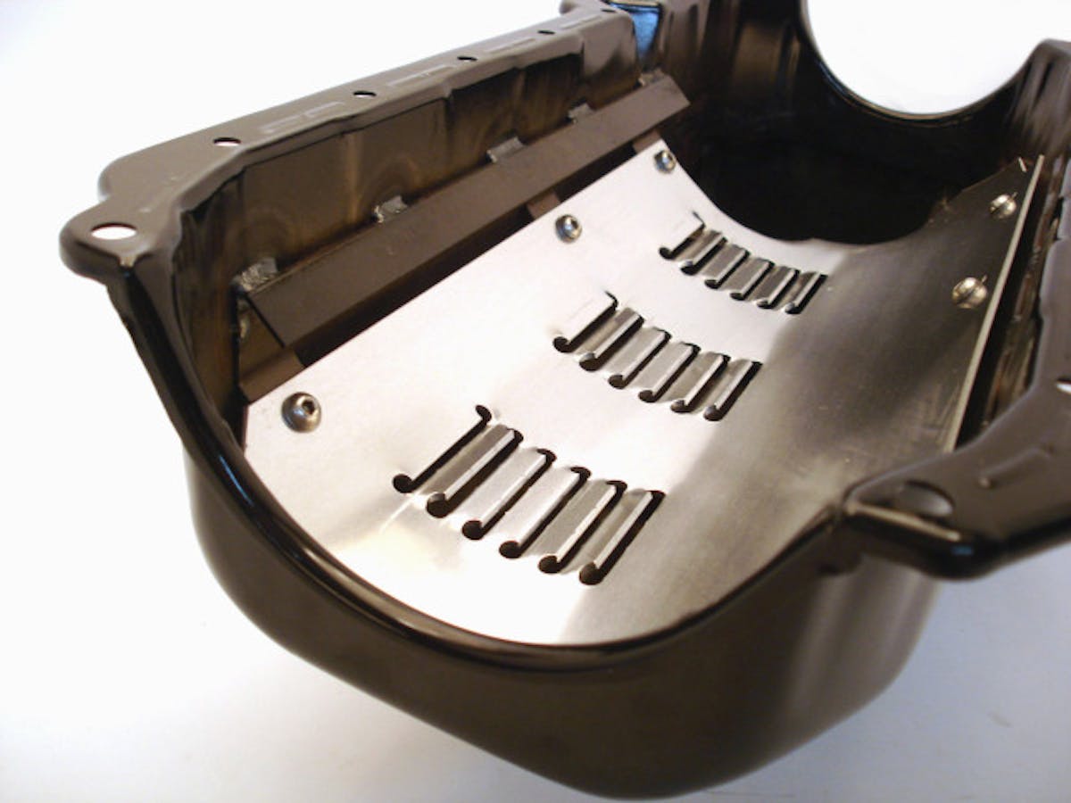The louvered windage tray on this Canton Racing LS oil pan not only helps maintain steady lubrication to the motor, it also helps free up horsepower that's lost when excess oil clings to the rotating crankshaft.