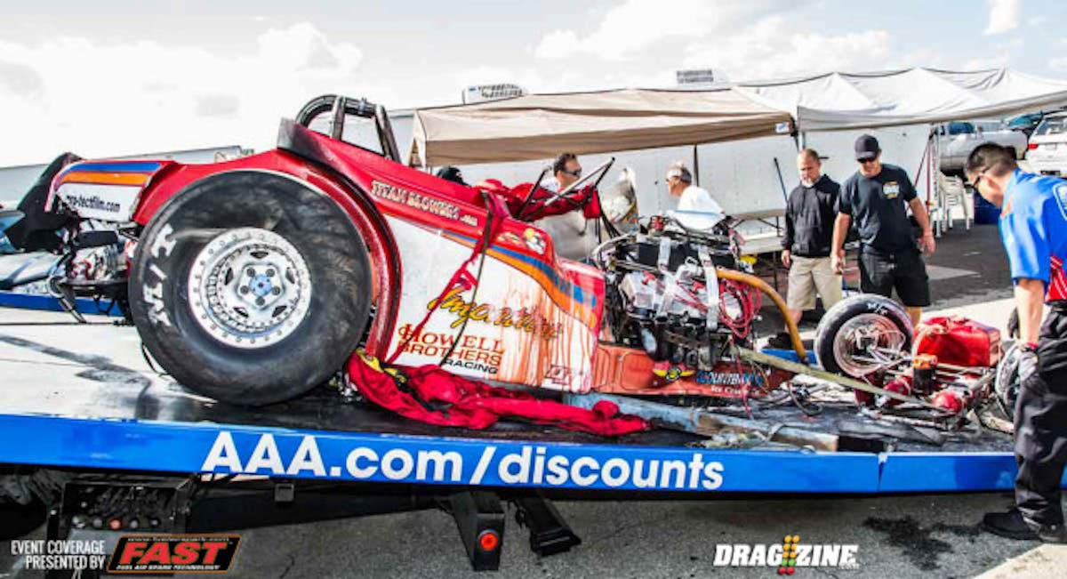 James Generalao Jr's AAFA being brought back to the pits after his on track collision with Tom Padilla