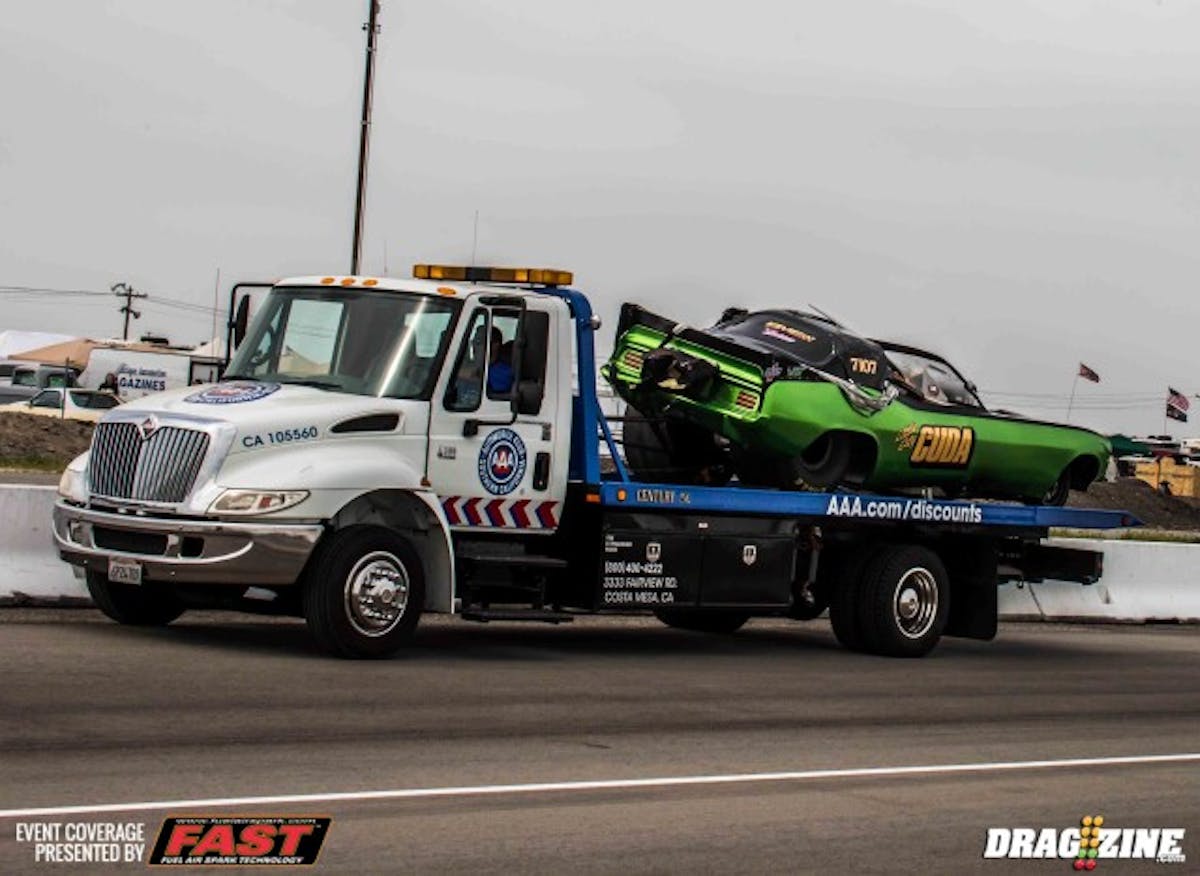 The Lil City Cuda being towed down the strip after an on track incident