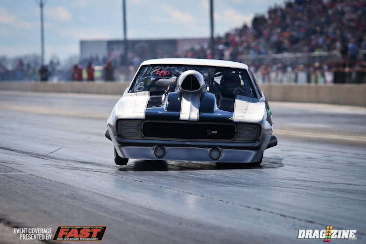 The 405's own James 'Doc' Love of Street Outlaws fame hopped behind the wheel of Larry Winger's nitrous-fed '69 Camaro today to take on the Big Tire class. Love got WAY out of shape in the first round and nearly collected the wall, but got the win light anyway. He told us this was the first time he'd ever sat in this car and misjudged the kind of horsepower he had under him.