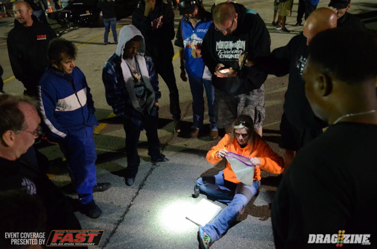 Shannon Morgan facilitates the drawing of poker chips for lanes and any money-split negotiations prior to the final rounds in the staging lanes.