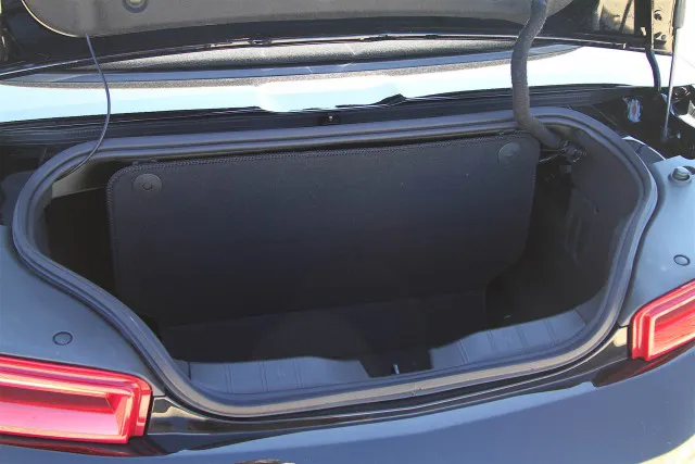 One obvious caveat with any convertible is that you'll be giving up trunk space when you put the top down. Divider in place, the Camaro's trunk only retains about the same capacity as an airliner overhead bin. Pop the divider loose, though (and remember not to put the top down!) and the trunk's full capacity is similar to the coupe, with what you can carry limited primarily by the small size of the trunk opening.