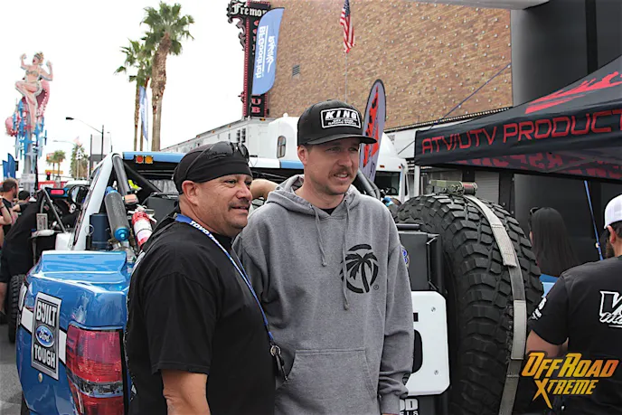 Jason Voss taking a picture with a fan during contingency.