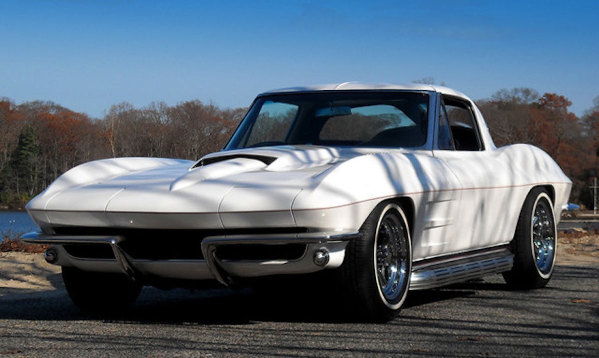 Mid-year Sting Rays are low-slung to begin with, but with a 2-inch suspension drop and ‘65 - ‘67 side-pipes, the car looks like a low rider. The ‘67 Stinger hood is an edgy classic that looks perfect on any mid-year. Cherry Bomb glass pack mufflers live under the factor side-pipe covers.