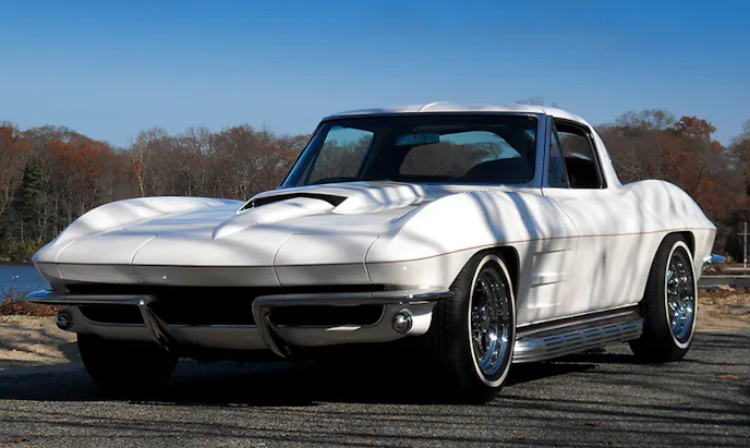 Mid-year Sting Rays are low-slung to begin with, but with a 2-inch suspension drop and ‘65 - ‘67 side-pipes, the car looks like a low rider. The ‘67 Stinger hood is an edgy classic that looks perfect on any mid-year. Cherry Bomb glass pack mufflers live under the factor side-pipe covers.