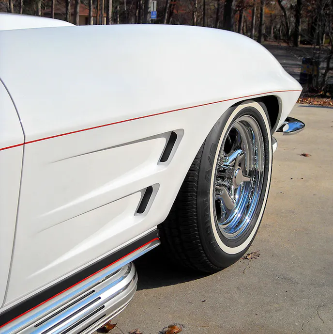 Factory side pipes weren’t available until 1965, but the Corvette community doesn’t mind seeing them on all mid-year Vettes. Cherry Bomb glasspack mufflers reside under the covers.