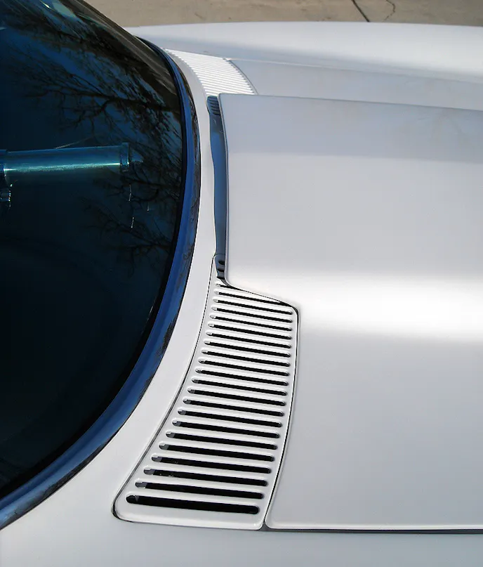 While not practical as an every day driver, the “no windshield wiper” look certainly is clean. The cowl vents had to be custom built, as the stock units have holes for the wiper motor shafts.