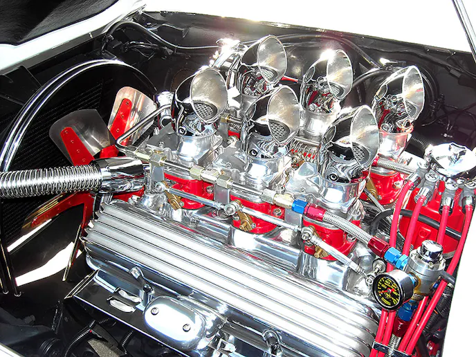 Jonathan has never had the engine dynoed, but with this setup, fuelie heads, and 4.11:1 gearing, this Split-Window Coupe is plenty quick. And with Cherry Bomb glass pack mufflers, the small-block sounds might sweet!